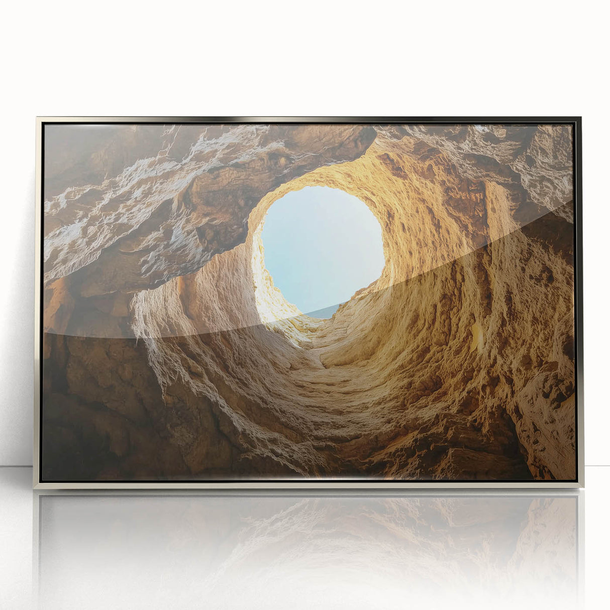Framed acrylic artwork featuring a serene landscape with caves, presented in a sleek silver frame, perfect for enhancing modern home decor. This captivating piece adds a touch of elegance and tranquility to any living space.