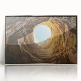 Framed acrylic artwork featuring a serene landscape with caves, presented in a sleek silver frame, perfect for enhancing modern home decor. This captivating piece adds a touch of elegance and tranquility to any living space.