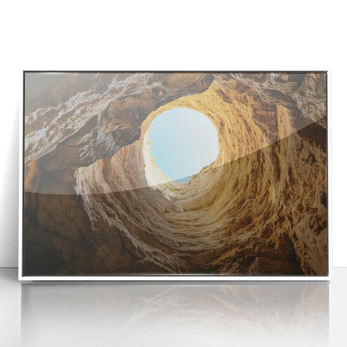 Framed acrylic artwork depicting a serene landscape with caves, featuring soft earth tones and a modern white frame, ideal for home decor and art enthusiasts.