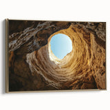 Framed canvas art depicting a stunning landscape scene featuring caves, accented with a luxurious gold frame, ideal for enhancing home decor with a touch of elegance.