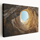 Stretched canvas artwork depicting a serene landscape with intricate cave formations and vibrant colors, ideal for enhancing home decor with a natural aesthetic.