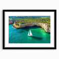 Black-framed landscape artwork showcasing dramatic cliffs and serene ocean views, elegantly matted for a sophisticated presentation, perfect for home decor.
