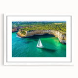 Framed landscape artwork depicting majestic cliffs with a white mat, showcasing vibrant colors and intricate details, perfect for home decor enhancement.