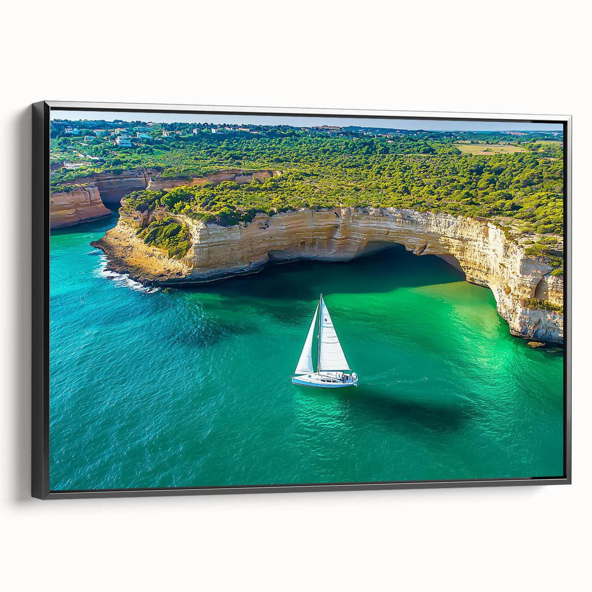 Framed canvas artwork showcasing a dramatic cliff landscape with rich colors, presented in a sleek black frame, ideal for enhancing modern home decor.