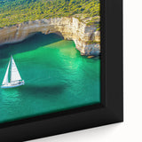 Close-up view of a framed canvas depicting a dramatic landscape with cliffs, showcasing vibrant colors and intricate details, perfect for home decor or art enthusiasts.