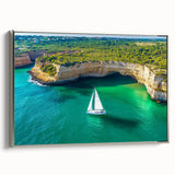 Framed canvas art depicting a serene landscape of cliffs, featuring a silver frame that enhances its elegance, perfect for modern home decor.