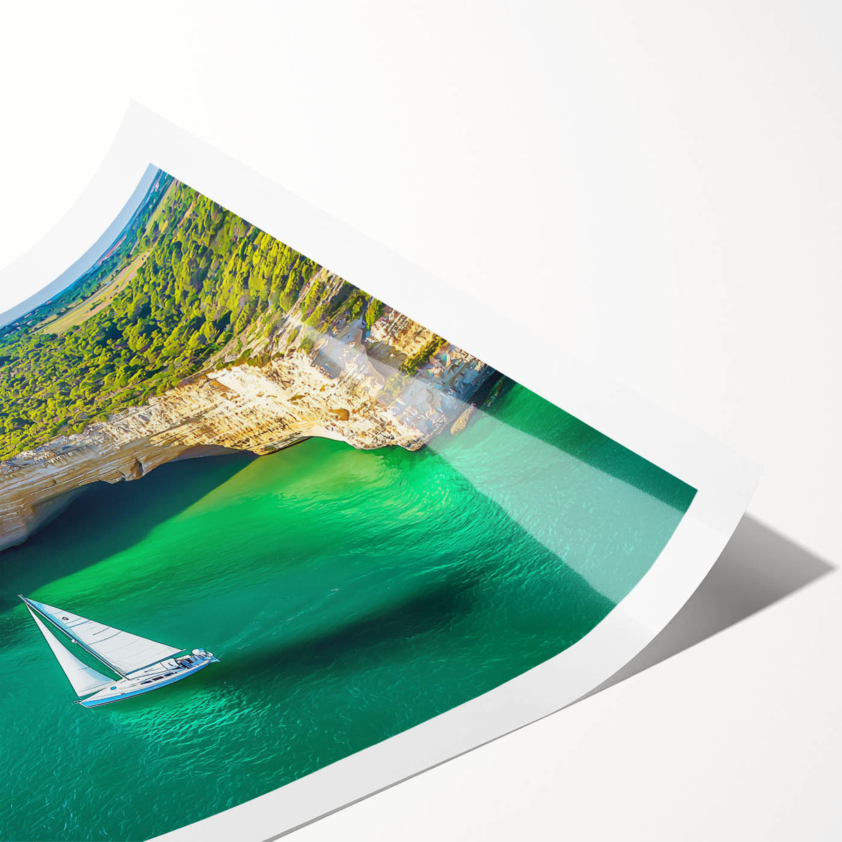 Stunning landscape print showcasing dramatic cliffs and a vibrant sky, rolled and securely packaged in a protective cardboard tube for easy transport and display.