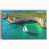 Stretched canvas artwork depicting a dramatic landscape of cliffs under a vibrant sunset, showcasing rich colors and intricate details, perfect for home decor.