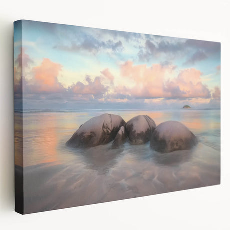 Stretched canvas artwork depicting a serene beach landscape in vibrant colors, showcasing gentle waves and palm trees, perfect for tropical-themed decor.