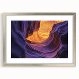 Framed landscape artwork depicting vibrant canyons in rich colors, featuring a sleek silver mat and frame, ideal for modern home decor or office settings.
