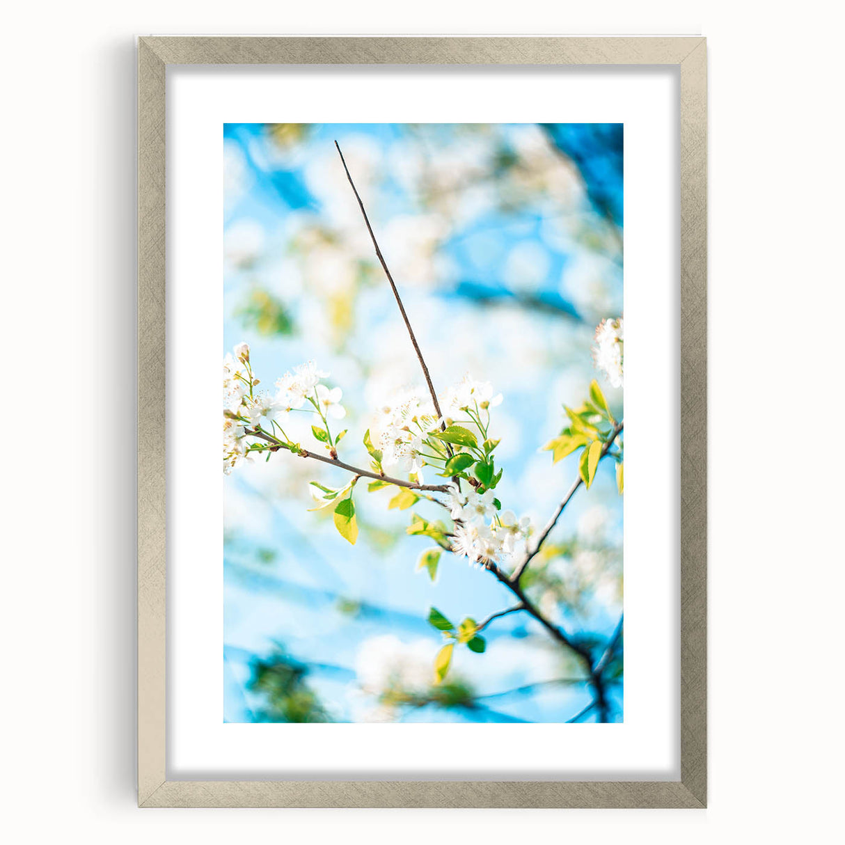 Textured abstract art print in muted green and yellow hues, framed with a silver mat, ideal for bedroom wall decor.