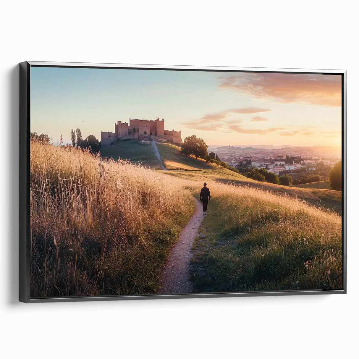 Framed canvas artwork showcasing a picturesque landscape with a majestic castle, set against a vibrant sunset, featuring a sleek black frame for modern decor.