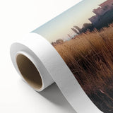 Rolled canvas showcasing a vibrant landscape with a majestic castle surrounded by lush greenery and a clear blue sky, designed for wall decor enthusiasts.
