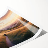 Rolled print showcasing a vibrant landscape featuring a majestic castle surrounded by lush greenery, elegantly packaged in a protective cardboard tube for easy transport.