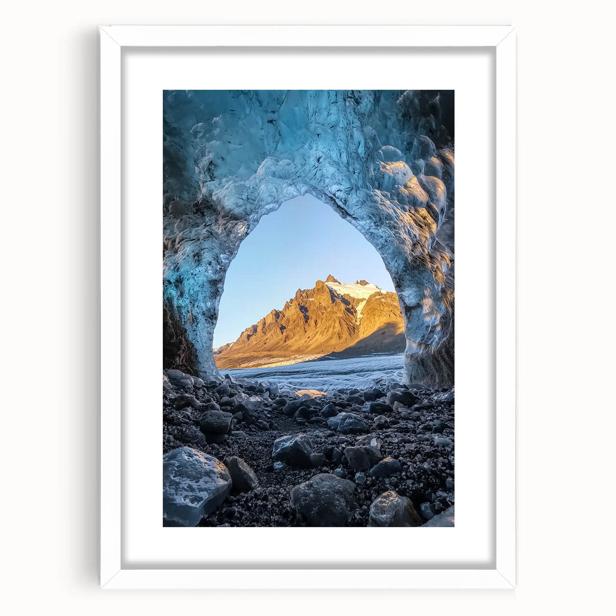Framed landscape print depicting a serene cave scene, featuring intricate details and a white mat for a polished look, perfect for home decor.
