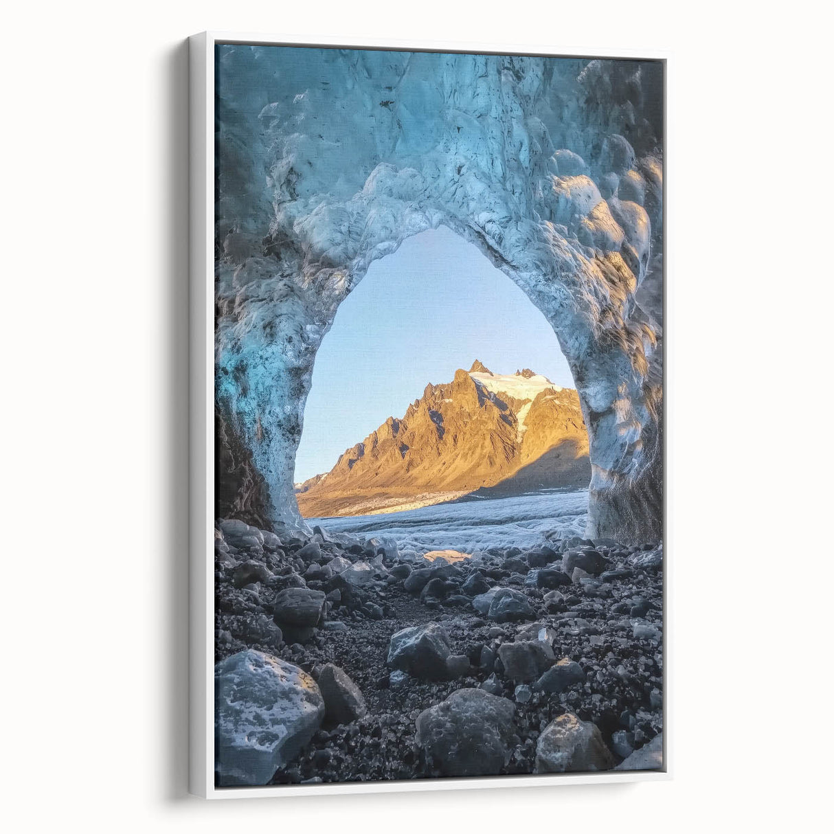 Framed canvas artwork showcasing a stunning landscape with caves, featuring earthy tones and intricate details, displayed in a white frame for a modern touch. Ideal for home decor enthusiasts seeking nature-inspired art pieces.