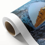 Rolled canvas artwork showcasing a vibrant, abstract landscape with cave motifs, wrapped securely in a durable cardboard tube, ideal for home decor enthusiasts.