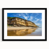 Framed landscape artwork showcasing dramatic cliffs under a clear blue sky, with a sleek black mat and frame, perfect for modern home decor.