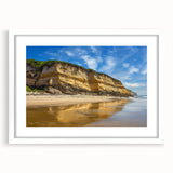 Framed landscape artwork depicting dramatic cliffs with a white mat, showcasing vibrant colors and intricate details, perfect for home decor enhancement.