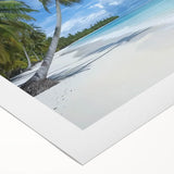 Vibrant rolled canvas artwork depicting a serene beach landscape with soft blue skies and gentle waves, elegantly packaged in a protective cardboard tube.