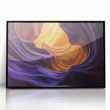 Framed acrylic artwork showcasing a stunning landscape of colorful canyons, featuring vibrant hues of orange and blue, mounted in a sleek black frame, perfect for modern decor.