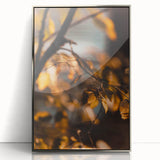 Mid-century modernist art of a fall scene in muted orange and brown tones, framed in silver acrylic.