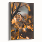 Framed canvas depicting a vintage landscape art painting of an autumnal scene with colorful trees and a black background.