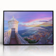 Framed acrylic artwork showcasing a stunning landscape featuring a majestic castle, set against a vibrant sky, with a sleek black frame enhancing its elegance.
