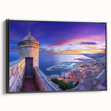 Framed canvas artwork showcasing a scenic landscape with a majestic castle, presented in a sleek black frame, ideal for home decor and enhancing interior aesthetics.