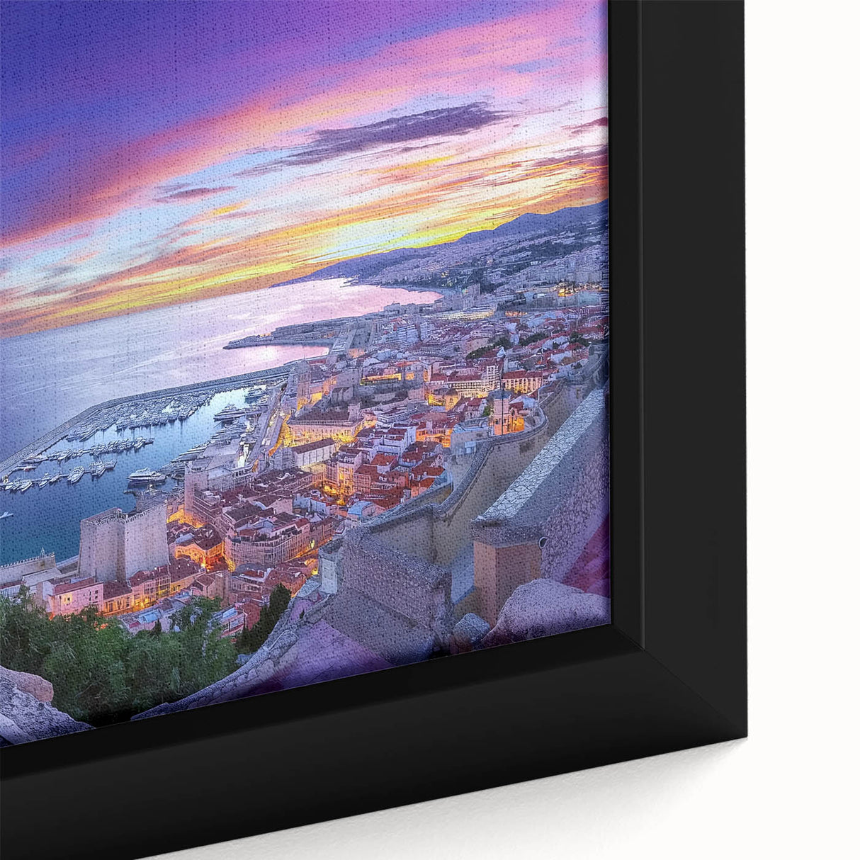 Close-up of a framed canvas artwork depicting a vibrant landscape featuring an ornate castle surrounded by lush greenery, ideal for home decor enthusiasts.