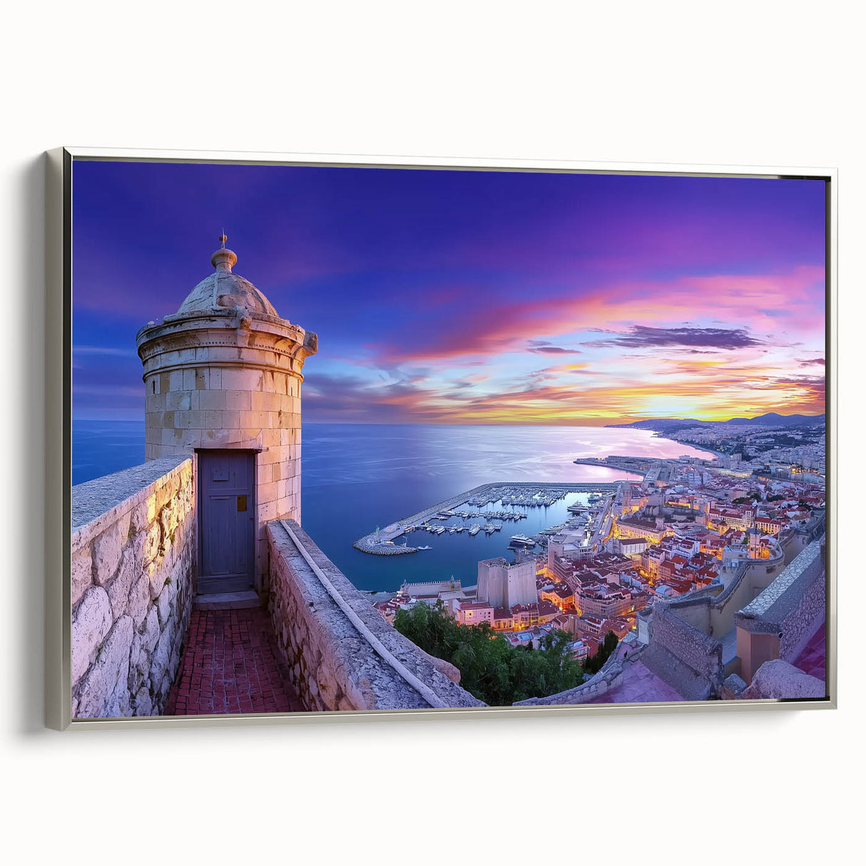 Framed canvas artwork depicting a serene landscape with a majestic castle, elegantly bordered in silver. Ideal for enhancing home decor with a touch of sophistication.