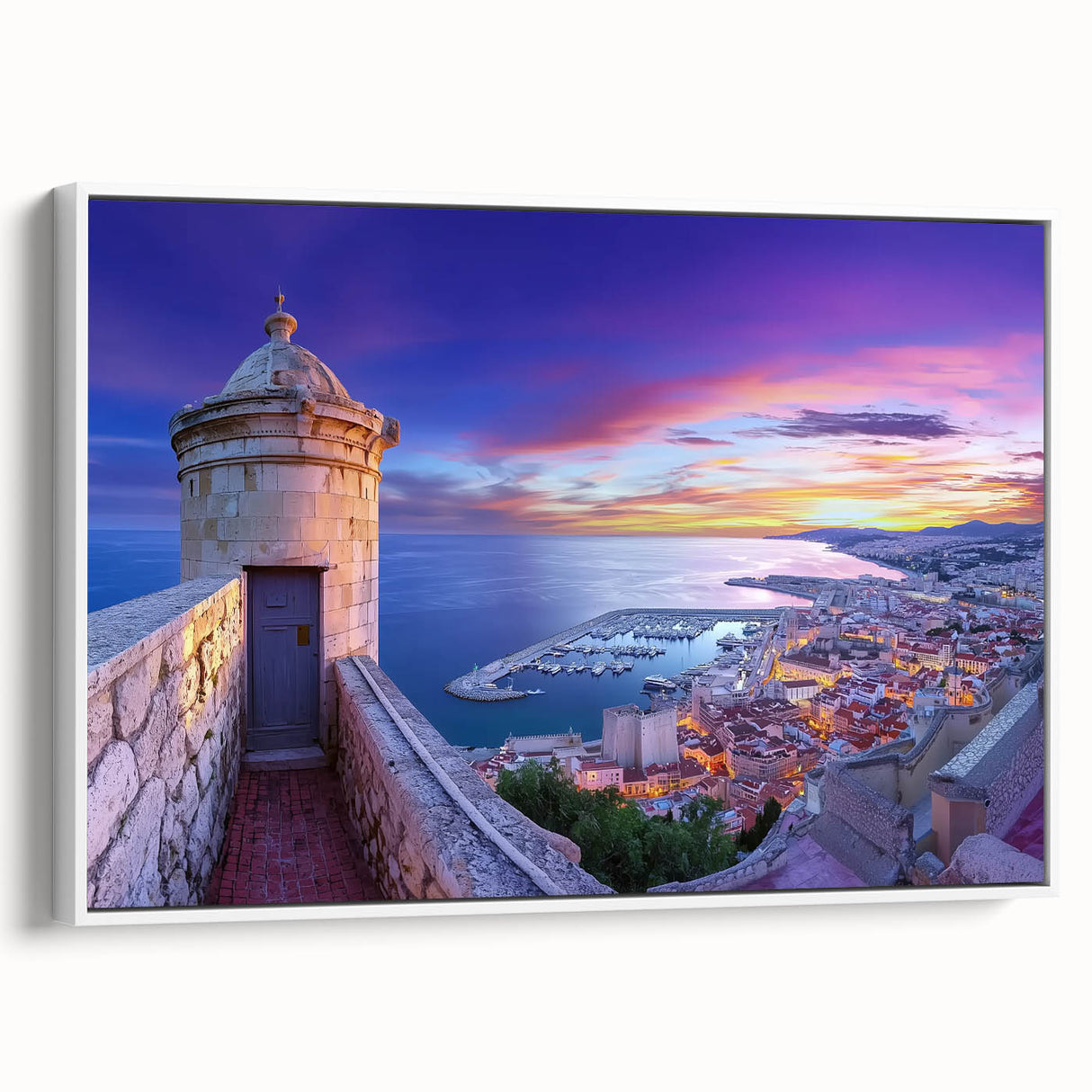 Framed canvas artwork showcasing a picturesque landscape with a majestic castle, featuring vibrant colors and a white frame, ideal for home decor.