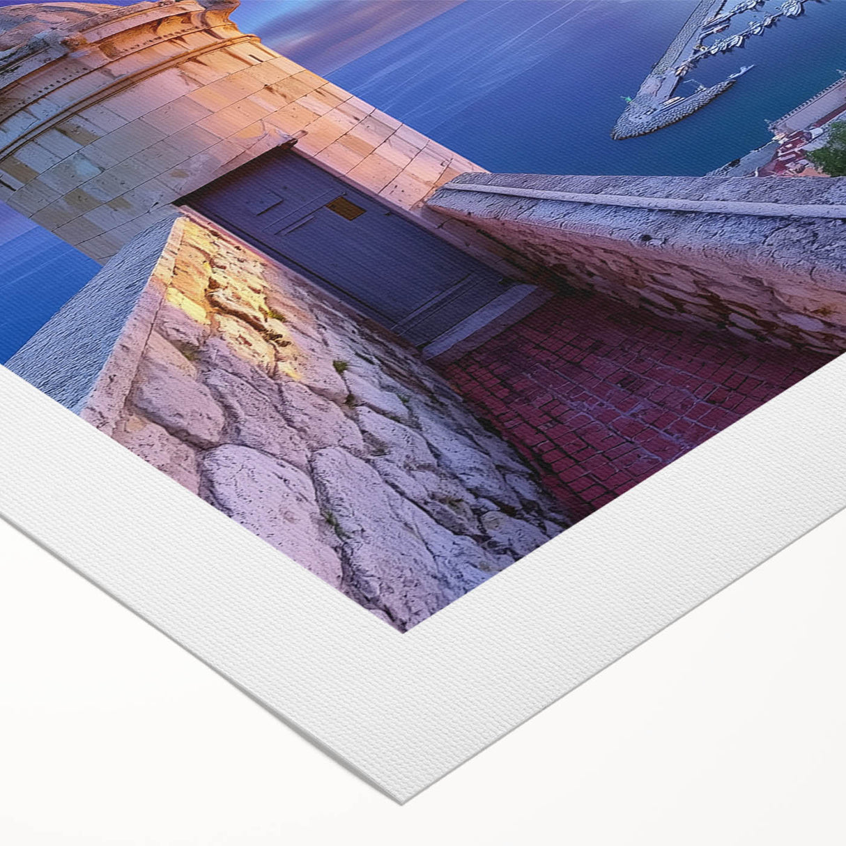 Rolled canvas artwork showcasing a picturesque landscape with a majestic castle surrounded by lush greenery, elegantly packaged in a protective cardboard tube for safe delivery.