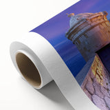 Rolled canvas artwork depicting a vibrant landscape with a majestic castle set against a dramatic sky. Perfect for enhancing home decor, it features rich colors and intricate details, ideal for art enthusiasts.