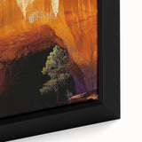 Close-up of a framed canvas artwork depicting a vibrant landscape with detailed cave formations, featuring earthy tones and intricate textures, ideal for home decor.