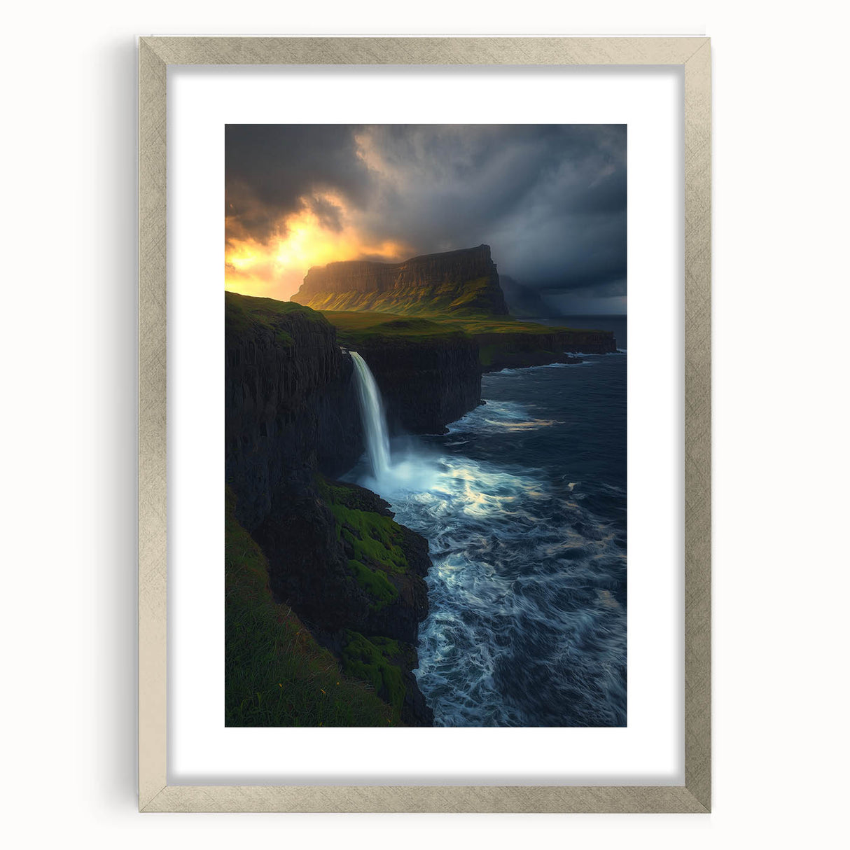 Silver-framed landscape artwork depicting rugged cliffs and serene nature, elegantly matted and suitable for home décor. Ideal for adding a touch of sophistication to any room.