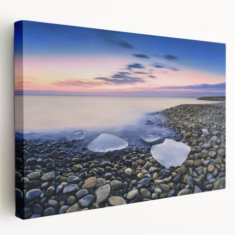 Stretched canvas artwork depicting a serene beach landscape, showcasing gentle waves and a vibrant sunset, ideal for coastal home decor and relaxation.