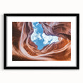 Black-framed landscape art print showcasing vibrant canyons, designed with a white mat for an elegant presentation, perfect for enhancing home decor.