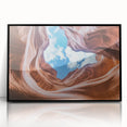 Framed acrylic landscape artwork showcasing majestic canyons in rich earth tones, presented with a sleek black frame, ideal for enhancing modern home decor.
