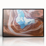 Framed acrylic landscape artwork showcasing majestic canyons in rich earth tones, presented with a sleek black frame, ideal for enhancing modern home decor.