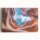 Stretched canvas artwork depicting vibrant, abstract landscape canyons in warm earth tones, designed to enhance modern home decor with a nature-inspired aesthetic.