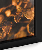 Close-up of black framed canvas featuring a textured, colorful abstract design, ideal for living room decor.
