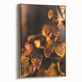 Framed canvas featuring a vintage-style landscape painting of autumn trees, with muted gold and black tones.