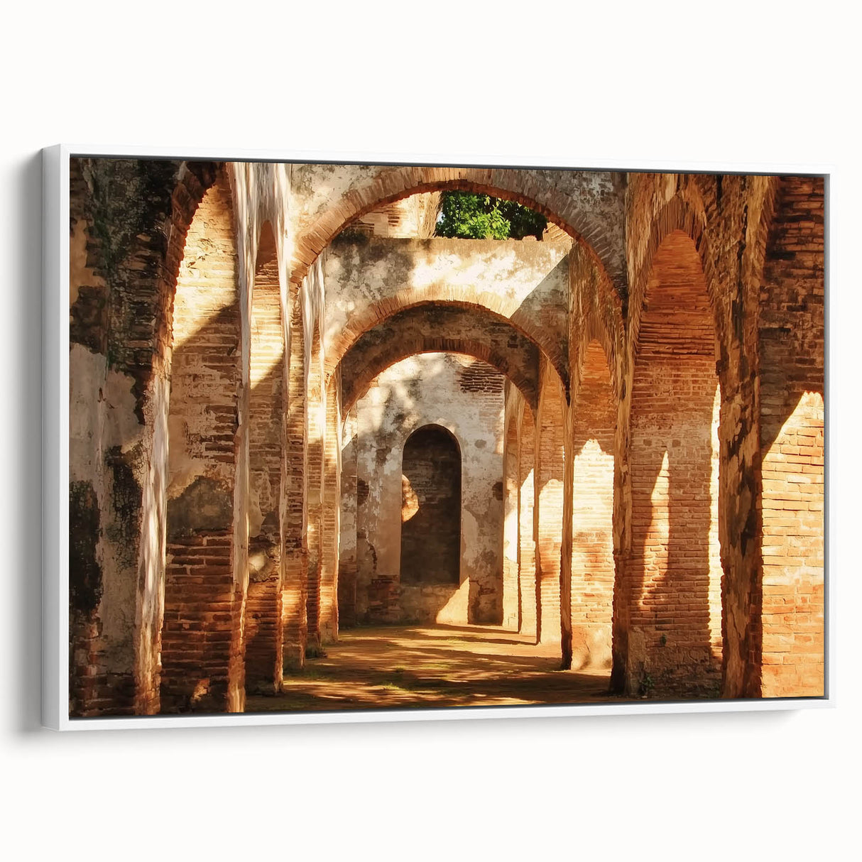 Framed landscape canvas art depicting a serene castle scene surrounded by lush greenery and a clear blue sky, showcased from a white side view.