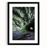 Framed landscape artwork showcasing intricate cave designs in a black mat, perfect for home decor, emphasizing natural beauty and artistic detail.