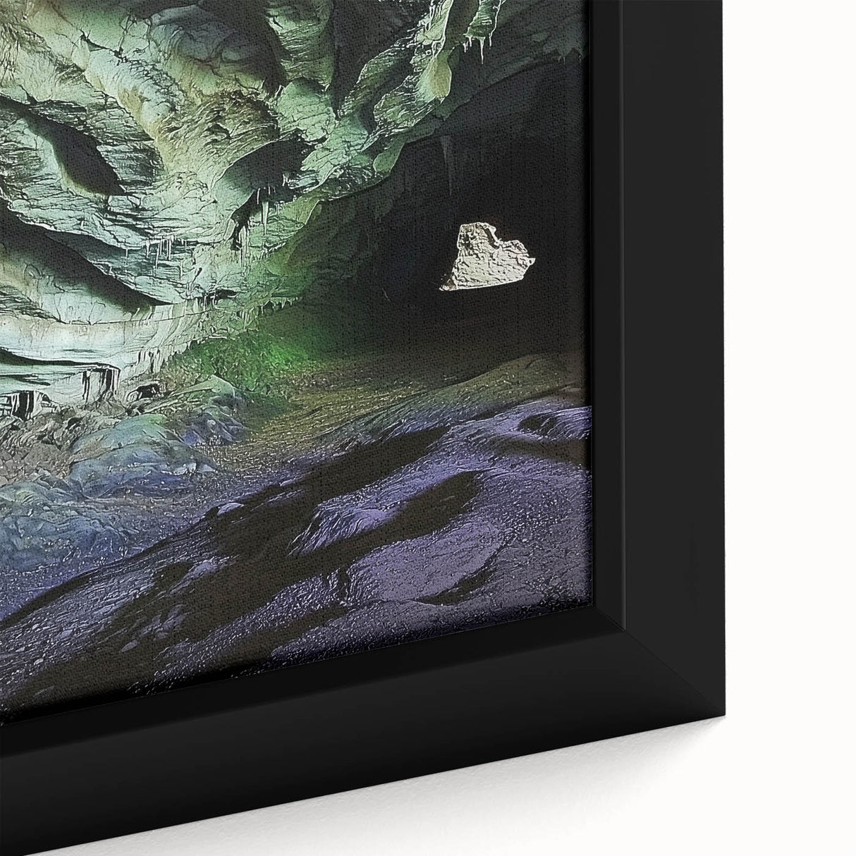 Close-up of a framed canvas print depicting a vibrant landscape with intricate cave designs, showcasing rich colors and textures ideal for home decor.