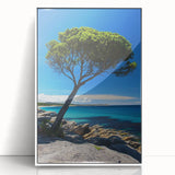 Framed acrylic artwork showcasing a stunning landscape of cliffs against a vibrant sky, featuring a white frame that enhances its modern aesthetic appeal.