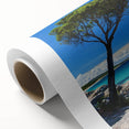 Vibrant rolled canvas depicting a stunning landscape with dramatic cliffs and lush greenery, elegantly packaged in a protective cardboard tube for safe delivery.