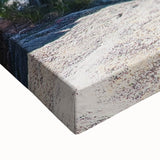 Close-up of a stretched canvas artwork depicting dramatic cliffs in a vibrant landscape, showcasing rich colors and intricate textures, perfect for home decor.