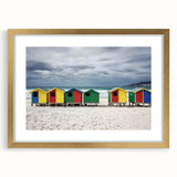 Framed landscape artwork featuring a serene beach scene with golden matting, perfect for home decor. Ideal for adding a coastal touch to any room.